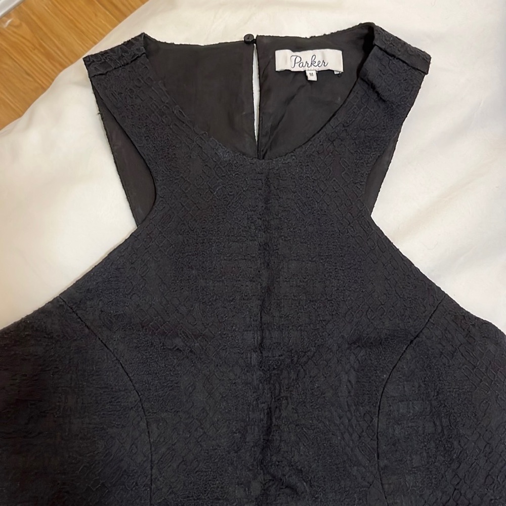 Black Parker Asymmetrical Dress with high neck and ruffled hem at bottom- size M